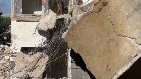 Collapsed Concrete Wall with Exposed Rebar