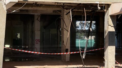 Demolished Building Interior with Hanging Cables