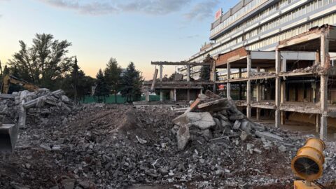 Demolition Site with Rubble and Exposed Building