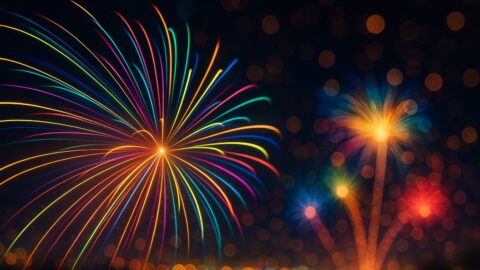 Colorful Fireworks Over City Lights