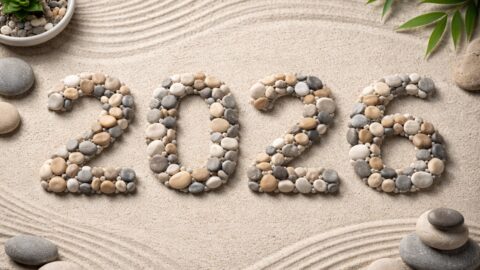 Zen Stone Numbers 2026 on Raked Sand Background
