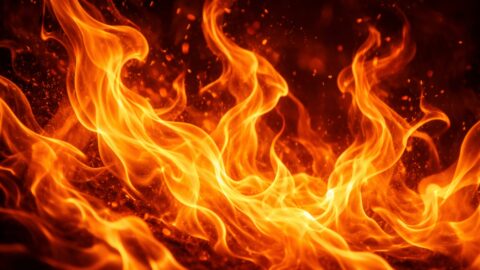 Blazing Orange Flames On Dark Background