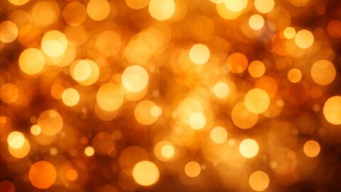 Golden Bokeh Lights On Warm Background